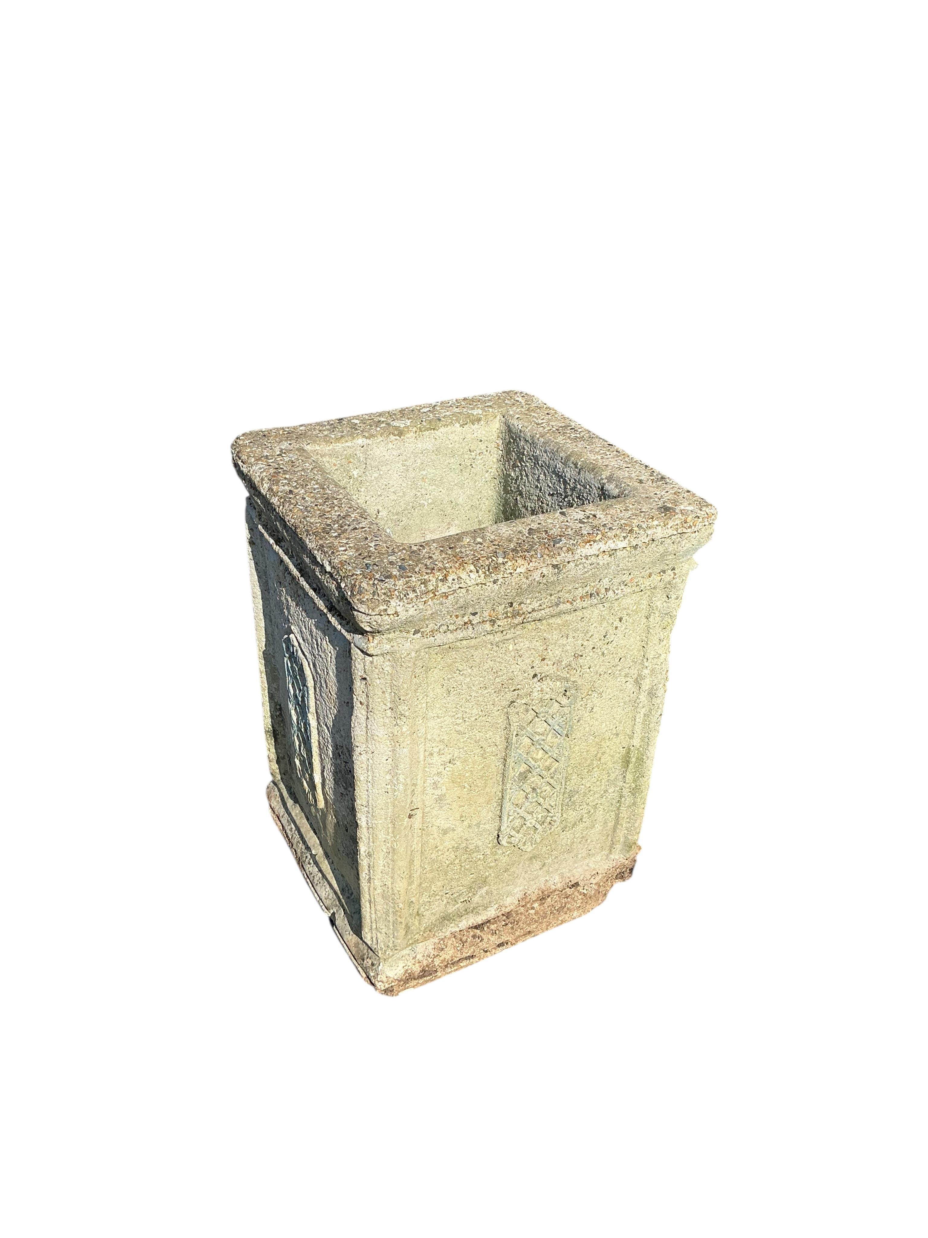 A square reconstituted stone garden planter, 36cm, height 50cm